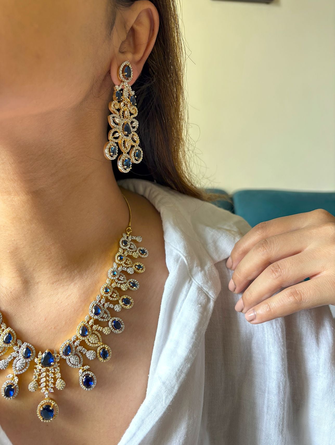 Shop Royal Sapphire Stone Heavy Necklace In AD With Gold & Rhodium Plating online in India. Explore elegant bridal AD jewellery online. Shop premium bridal jewellery sets in Zircon, AD, Kundan, Victorian Diamond. Collection best suited for Indian weddings, parties and special occasions. Choose AD Necklace in blue stone for sarees, lehengas and gowns. -side