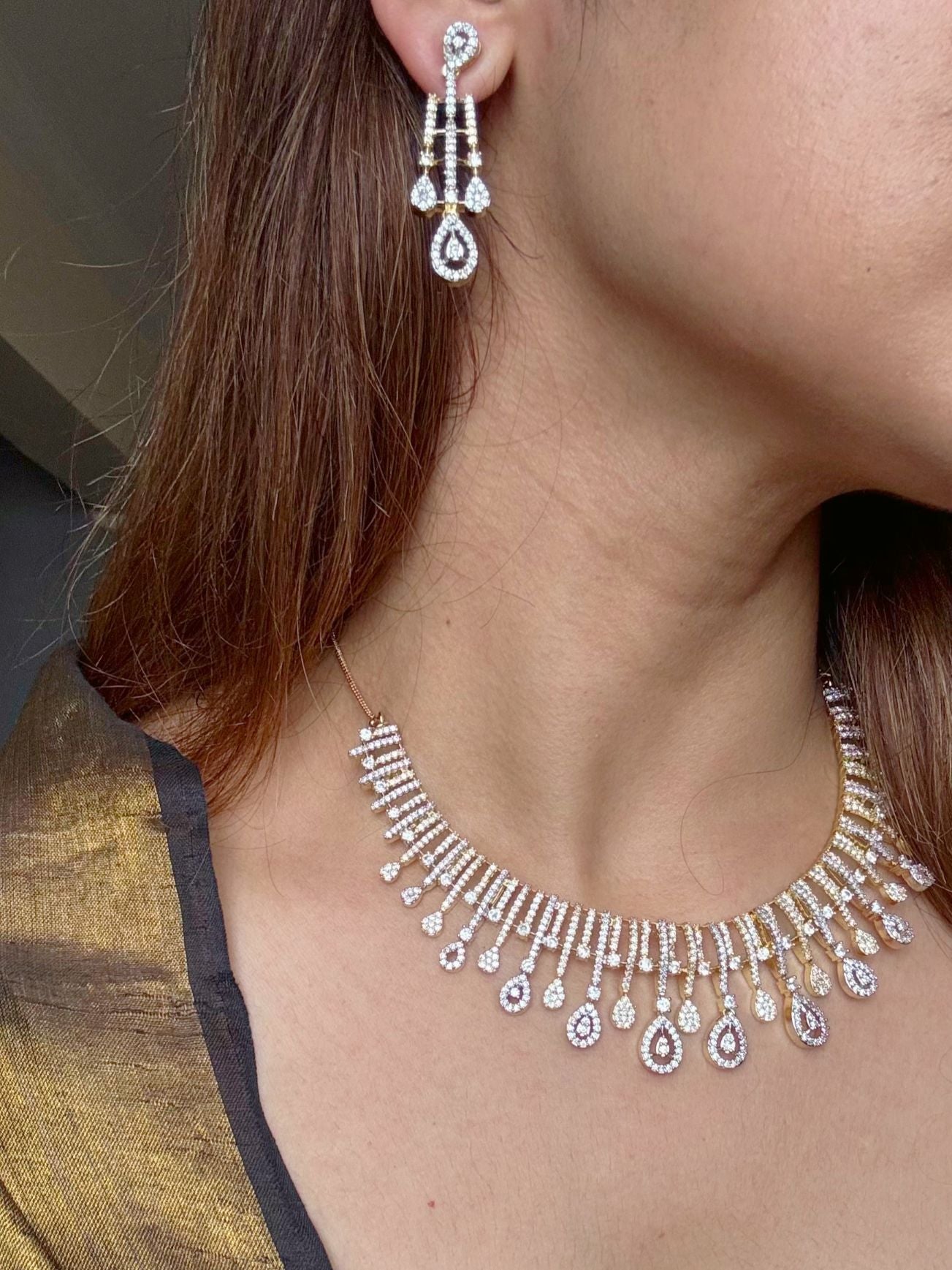 Shop Beautiful Gold Polish Set In AD For Sarees online in India. Explore elegant bridal AD jewellery online. Shop premium bridal jewellery sets in Zircon, AD, Kundan, Victorian Diamond. Collection best suited for Indian weddings, parties and special occasions. Choose AD Necklace in gold polish for sarees, lehengas and gowns. -first