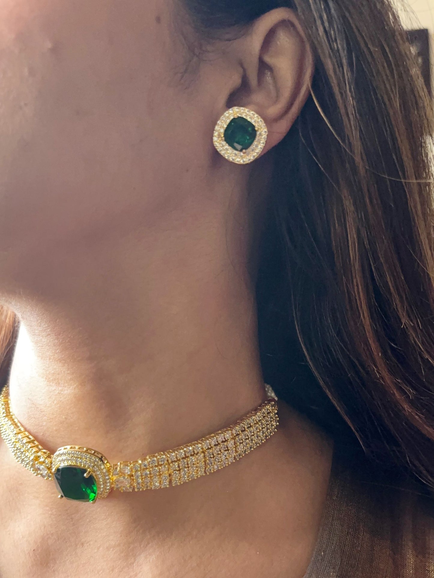 Shop Green Stone Choker in AD with Gold Finish online in India. Explore elegant bridal AD jewellery online. Shop premium bridal jewellery sets in Zircon, AD, Kundan, Victorian Diamond. Collection best suited for Indian weddings, parties and special occasions. Choose AD Necklace in green stone for sarees, lehengas and gowns. -side