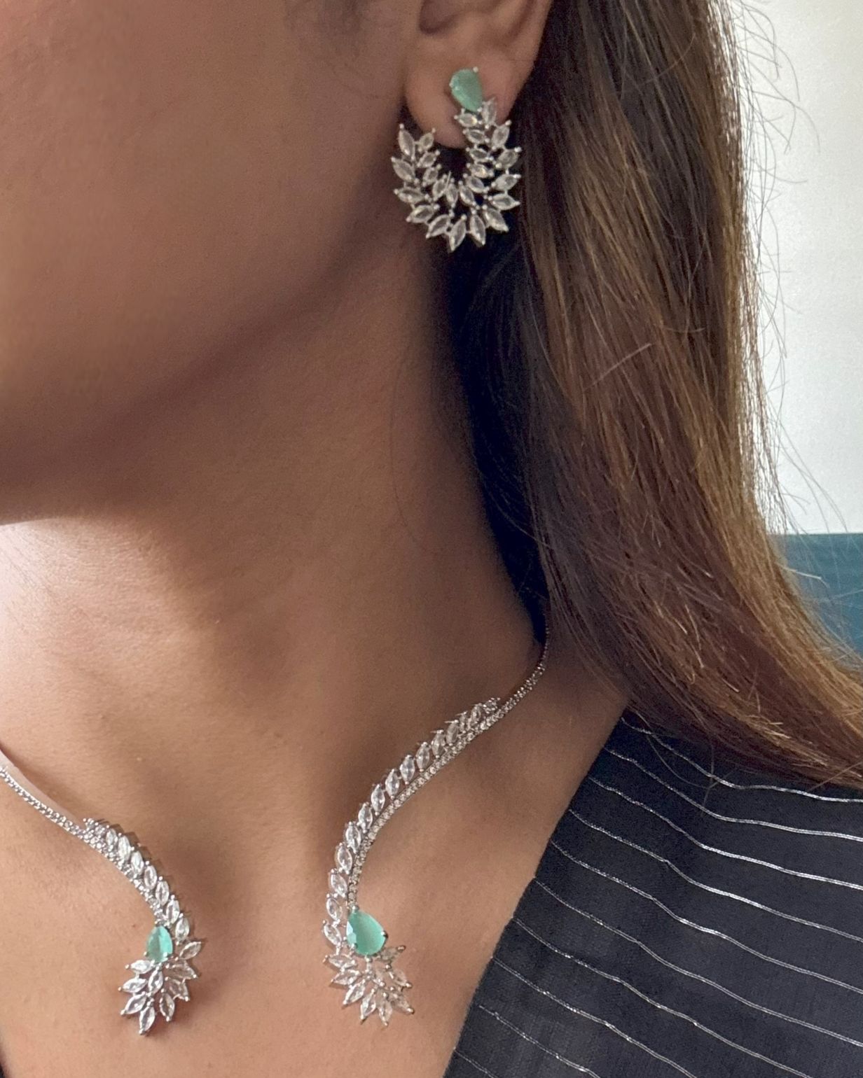 Shop Hasli Set With Floral Design in AD & Mint Green Stone Online in India. Perfect for brides seeking elegant AD jewellery online. Explore premium bridal jewellery online in AD, ideal for Indian weddings and special occasions. Shop AD jewellery in green stone online. -front
