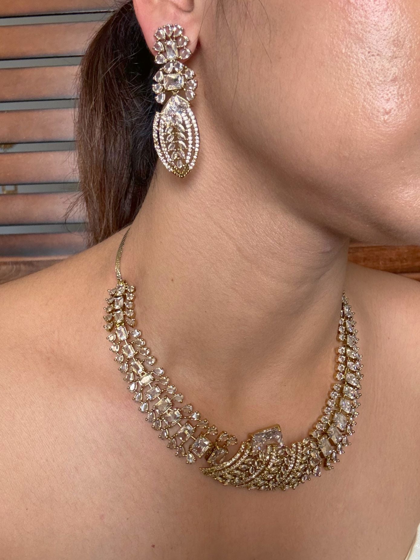 Buy Zarisha Royal AD Necklace and Earrings Set In White online in India. Shop from an exclusive range of jewellery, AD necklace, Kundan necklace for weddings. -side