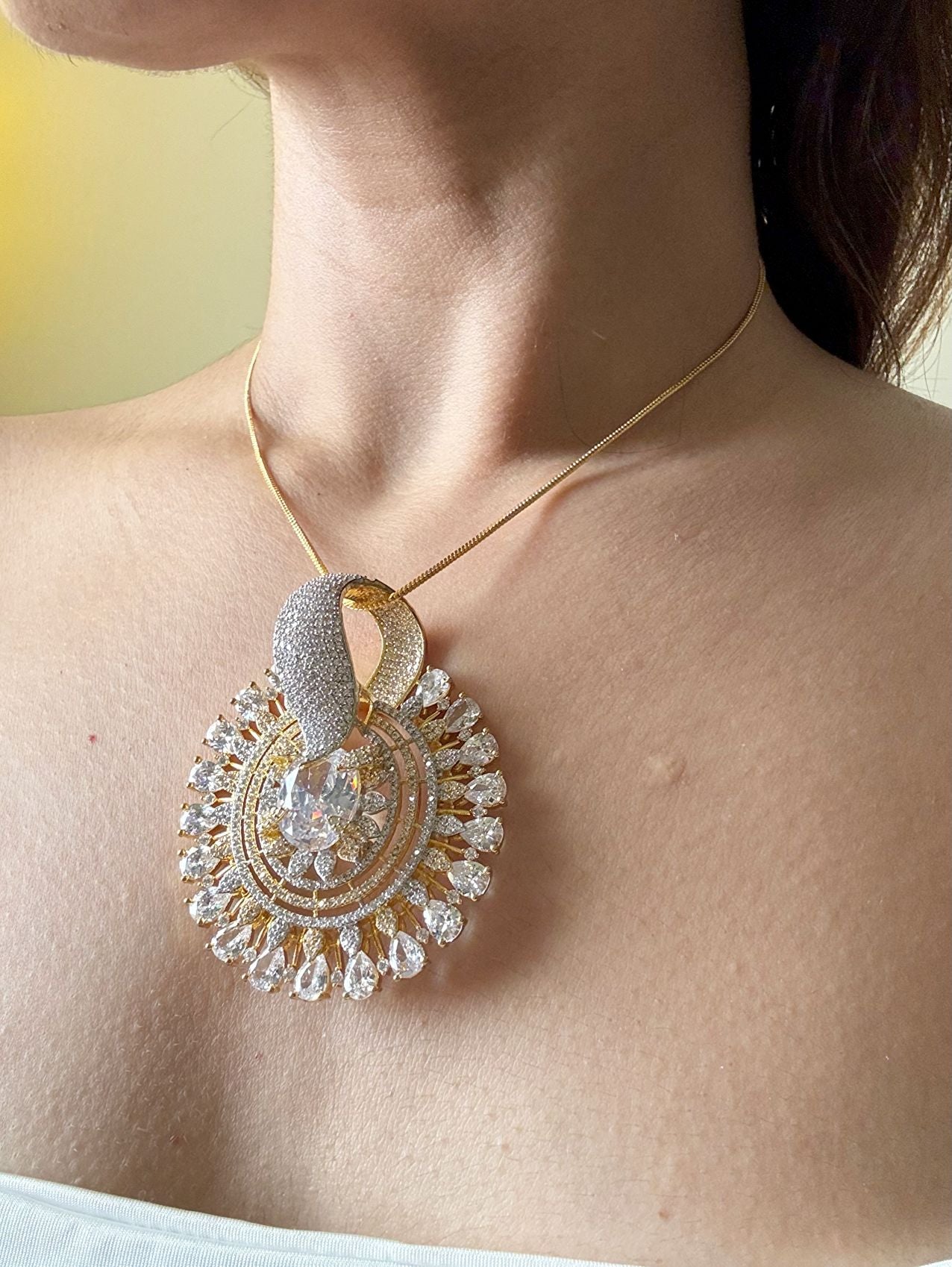 Shop Gorgeous Big Round Pendant Set In Gold & AD Stones Online in India. Pendant sets in different stones like Kundan, Moissanite, CZ stones and AD stones in all kinds quality are available online for purchase on website. Explore pendant sets for festive occasions perfect mothers and elderly ladies too. Pendant sets in green, blue, pink, red and white stones are available for wearing with sarees, lehengas, suits and Indo-westerns. -first