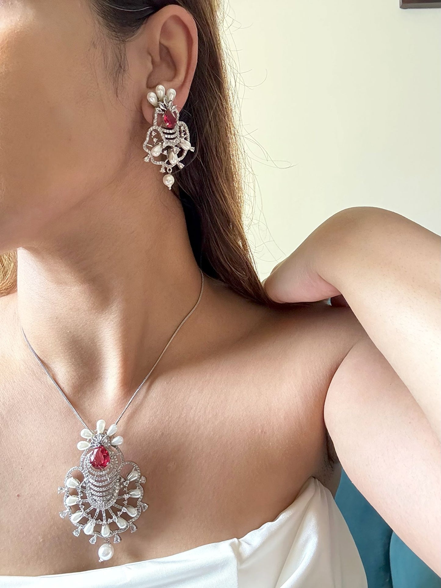 Shop Ruby Love Floral Pendant Set In AD & Pearls Online in India. Pendant sets in different stones like Kundan, Moissanite, CZ stones and AD stones in all kinds quality are available online for purchase on website. Explore pendant sets for festive occasions perfect mothers and elderly ladies too. Pendant sets in green, blue, pink, red and white stones are available for wearing with sarees, lehengas, suits and Indo-westerns. -fulllook