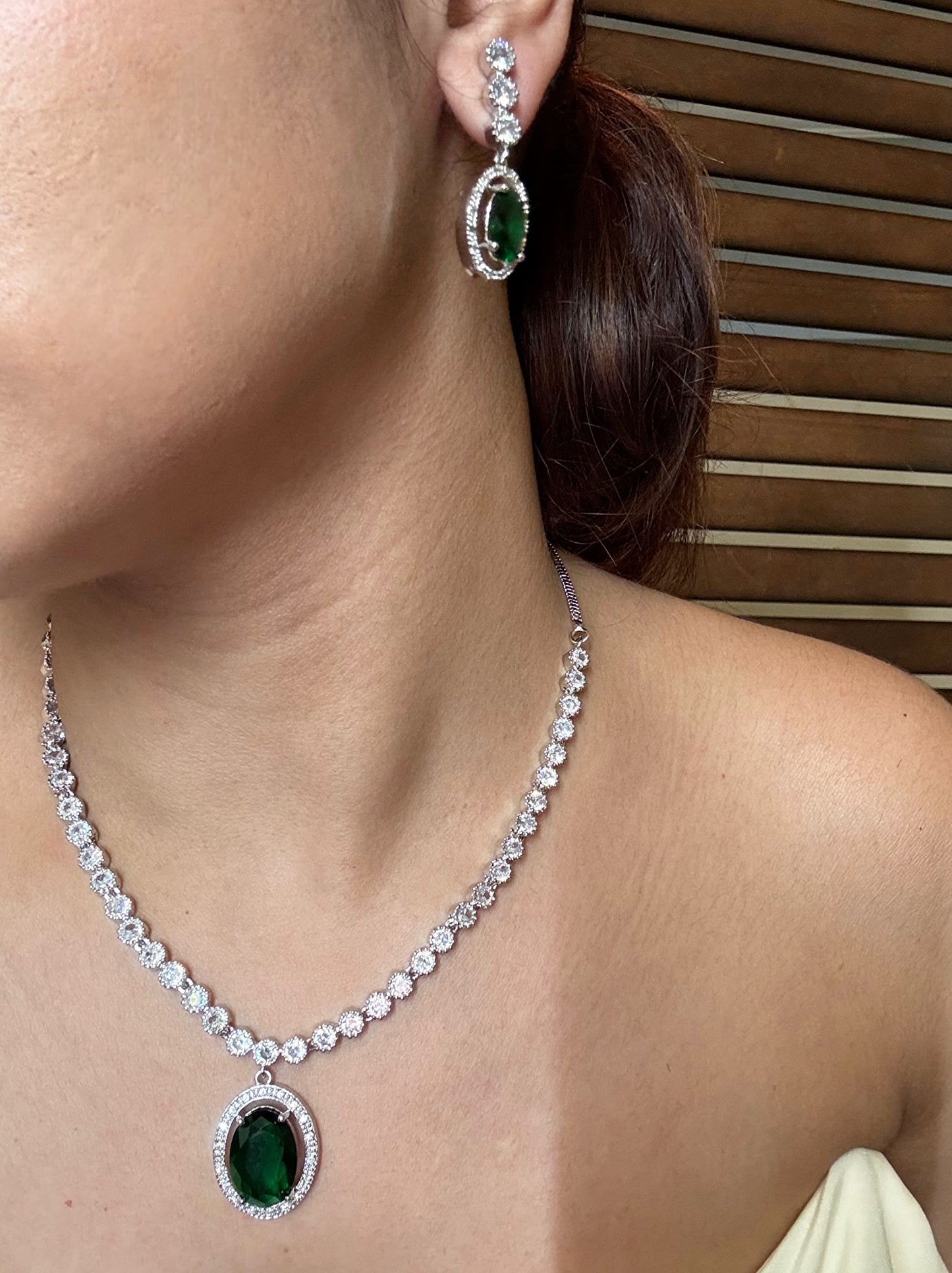 Buy green pendant AD necklace online in India with earrings. Shop an exclusive range of zircon jewellery, Indian wedding jewelry, kundan jewellery, AD earrings, AD necklace.-side