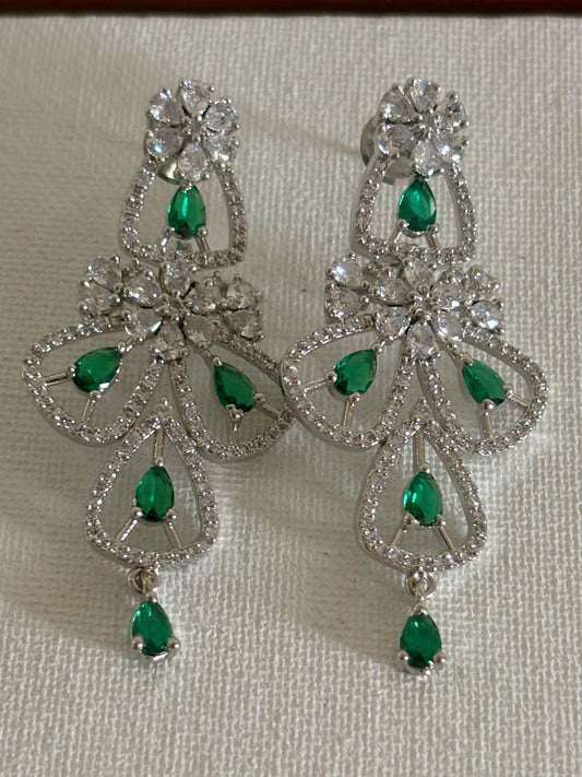 Shop women's luxury green stone AD earrings online in India. Shop from an exclusive range of zircon jewellery, Indian wedding jewelry, gold plated earrings, rhodium plated jewellery, AD earrings, AD necklace sets for weddings, engagements and parties.  -front