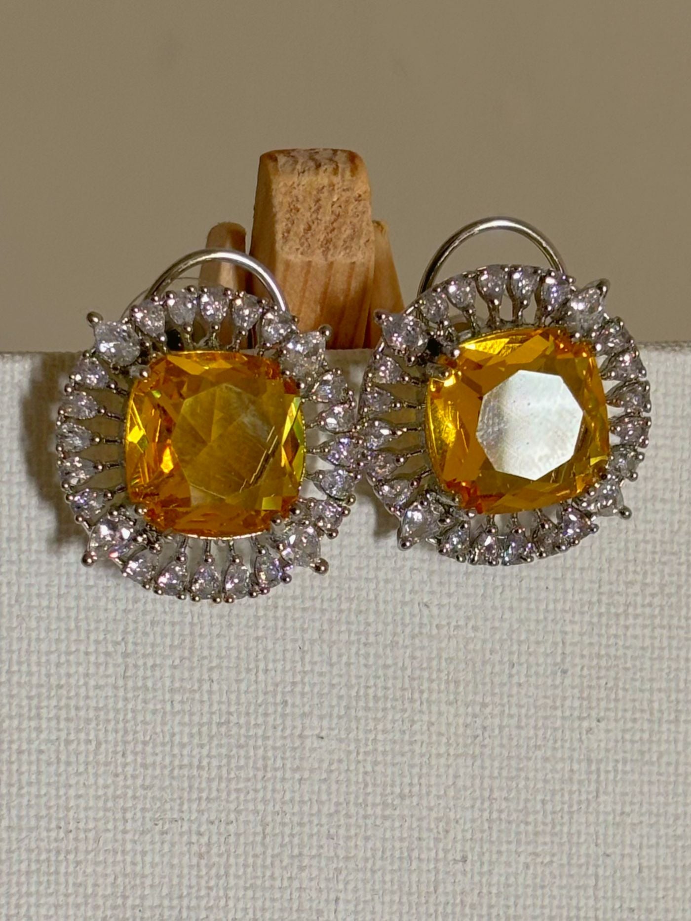 Shop Contemporary Studs In AD & Golden Yellow Stone online. Shop from an exclusive range of zircon earrings, bridal AD jewelry, silver plated earrings, rhodium plated jewellery, AD earrings, AD necklace sets for weddings, engagements and parties.  -first