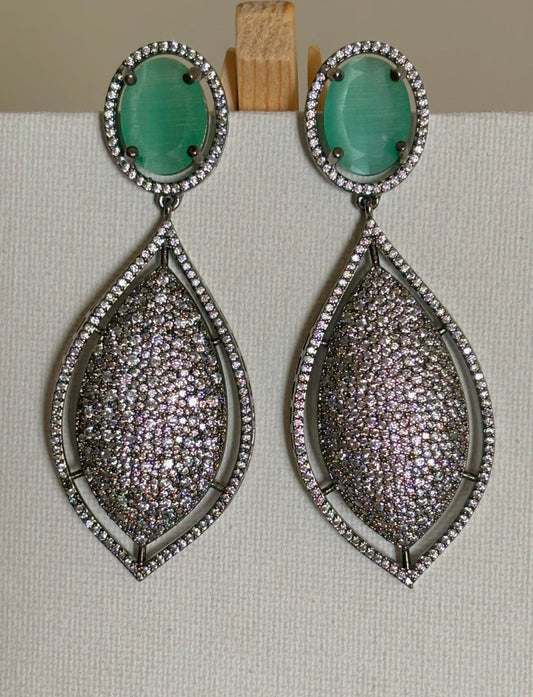 Shop women's Designer Nano Setting AD Earrings With Mint Green Stone online in India. Shop from an exclusive range of zircon jewellery, bridal wedding jewelry, silver plated earrings, rhodium plated jewellery, AD earrings, AD necklace sets for Lehengas, suits, sarees and gowns.  -Front