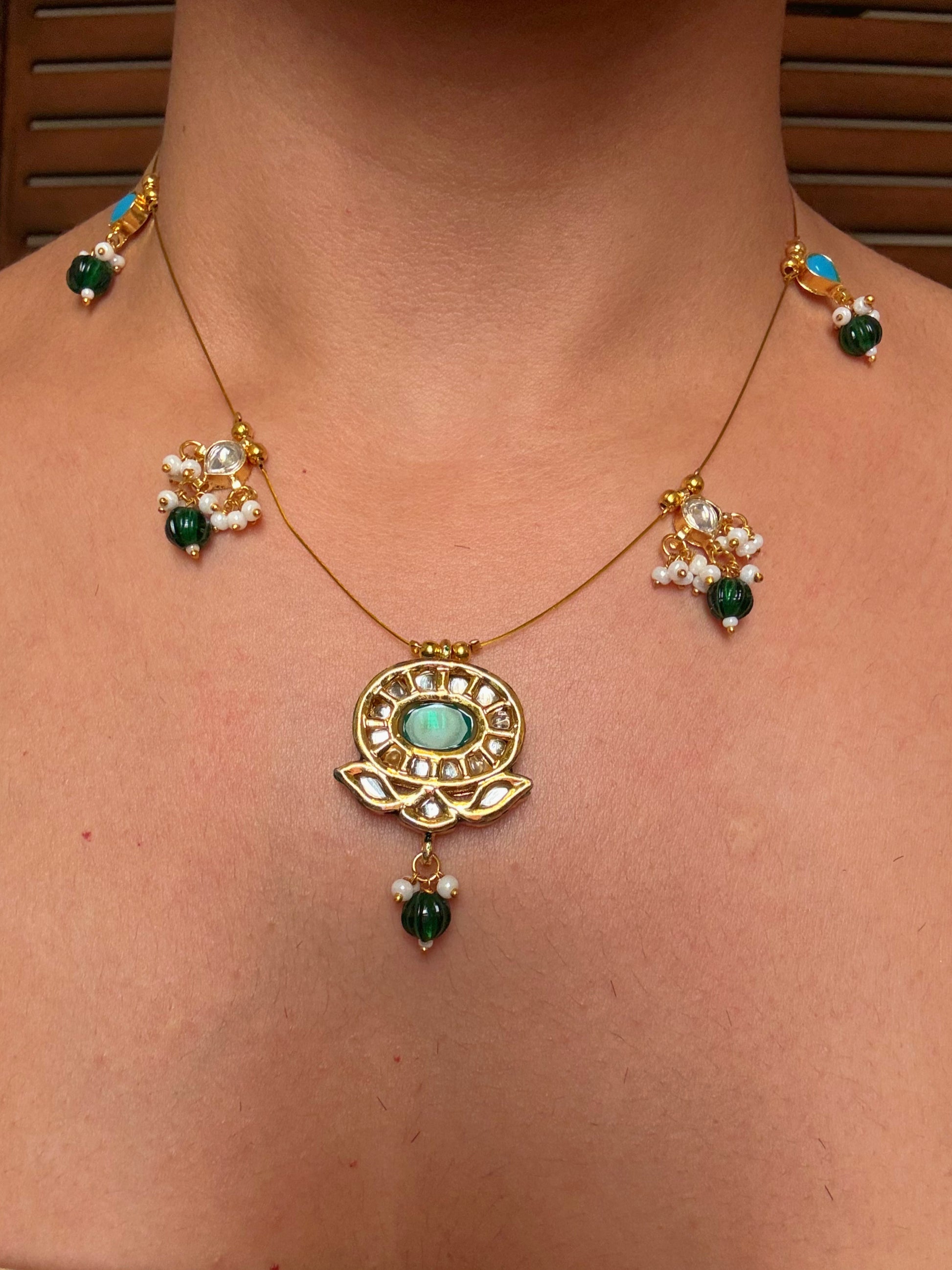 Buy gold plated kundan and pearl motif wire necklace online in India. Shop from an exclusive range of CZ jewellery, gold plated, silver plated jewellery, gold polish earrings. -closeup