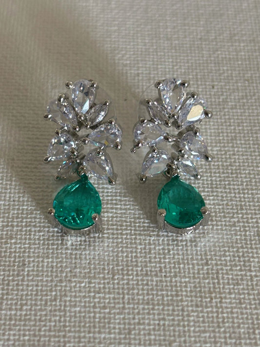Shop Subtle Glow Green Stone Drop AD Earrings online in India. Shop from an exclusive range of zircon jewellery, bridal wedding jewelry, silver plated earrings, rhodium plated jewellery, AD earrings, AD necklace sets for Lehengas, suits, sarees and gowns. -front