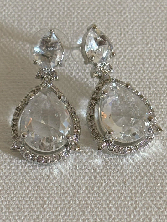 Shop Celebrity Look Double Drop White Stone AD Earrings online. Shop from an exclusive range of zircon earrings, bridal AD jewelry, silver plated earrings, rhodium plated jewellery, AD earrings, AD necklace sets for coats, gowns and lehengas.  -front