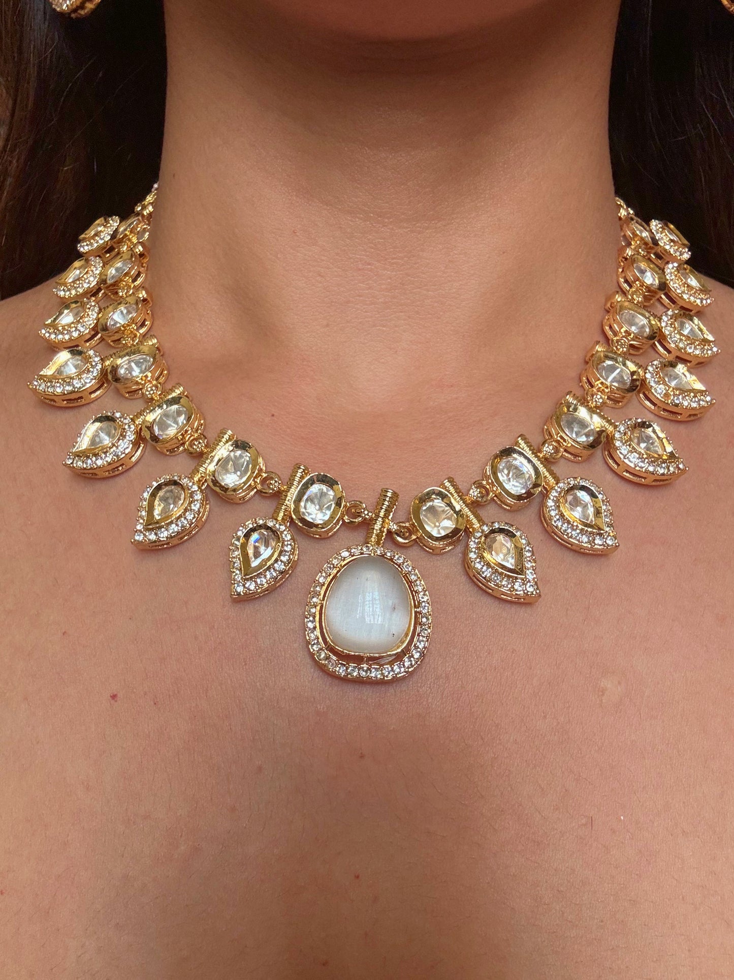 Buy white double and kundan gold plated necklace set online in India. Shop from an exclusive range of CZ jewellery, gold plated, silver plated jewellery, gold polish earrings. -closeup