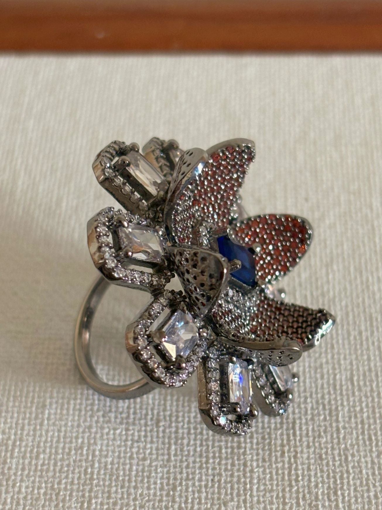 Shop Adjustable Nano Setting Floral Shape AD Cocktail Ring online in India. Shop from an exclusive range of zircon jewellery, bridal wedding jewellery, silver plated earrings, rhodium plated rings, AD rings, AD earrings for office parties, cocktail dresses and sangeet night. -side