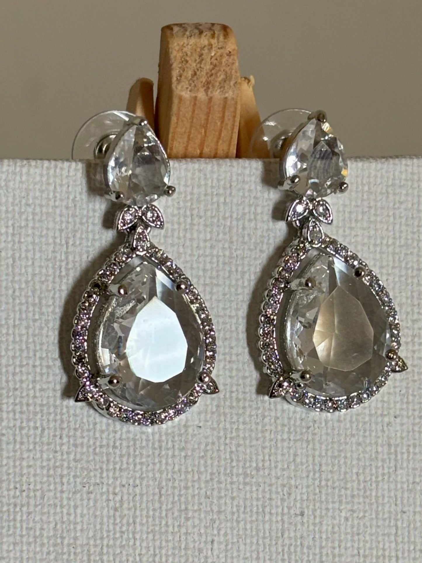 Shop Celebrity Look Double Drop White Stone AD Earrings online. Shop from an exclusive range of zircon earrings, bridal AD jewelry, silver plated earrings, rhodium plated jewellery, AD earrings, AD necklace sets for coats, gowns and lehengas.  -first