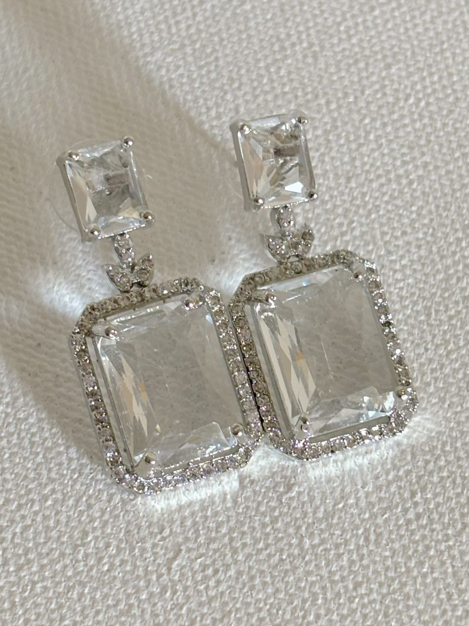 Shop women's luxury white doublet stone AD earrings online in India. Shop from an exclusive range of zircon jewellery, Indian wedding jewelry, gold plated earrings, rhodium plated jewellery, AD earrings, AD necklace sets for weddings and festive occasions. -front