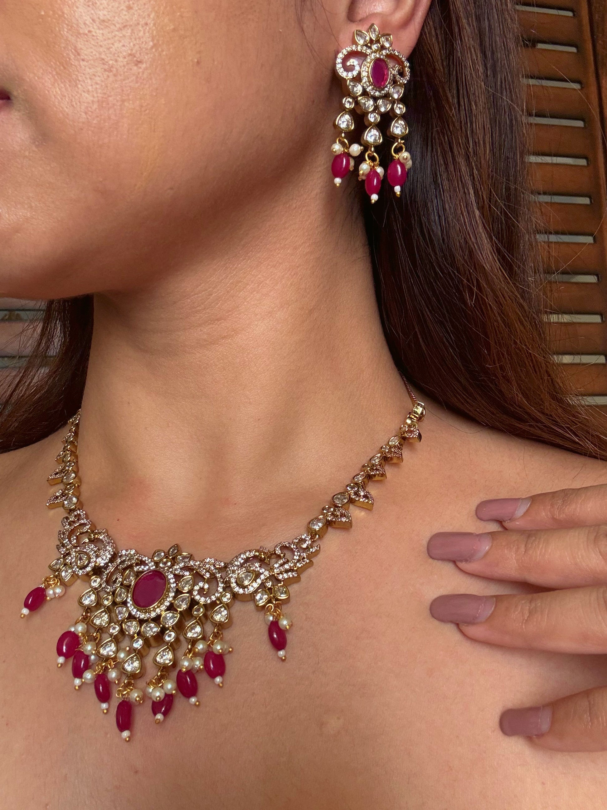 Shop kundan and ruby gold plated necklace set online in India. Shop from an exclusive range of CZ jewellery, gold plated, silver plated jewellery, gold polish earrings. -full view