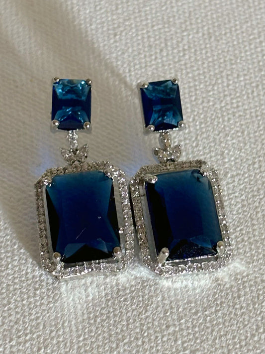 Shop women's luxury white doublet stone AD earrings online in India. Shop from an exclusive range of zircon jewellery, Indian wedding jewelry, AD earrings with saree, rhodium plated jewellery, AD necklace sets for weddings and engagement. AD jewellery in blue stone-front