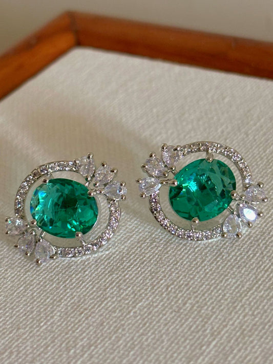 Shop Celebrity Studs In AD & Green stone online. Shop from an exclusive range of zircon earrings, bridal AD jewelry, silver plated earrings, rhodium plated jewellery, AD earrings, AD necklace sets for weddings, engagements and parties.  -Front
