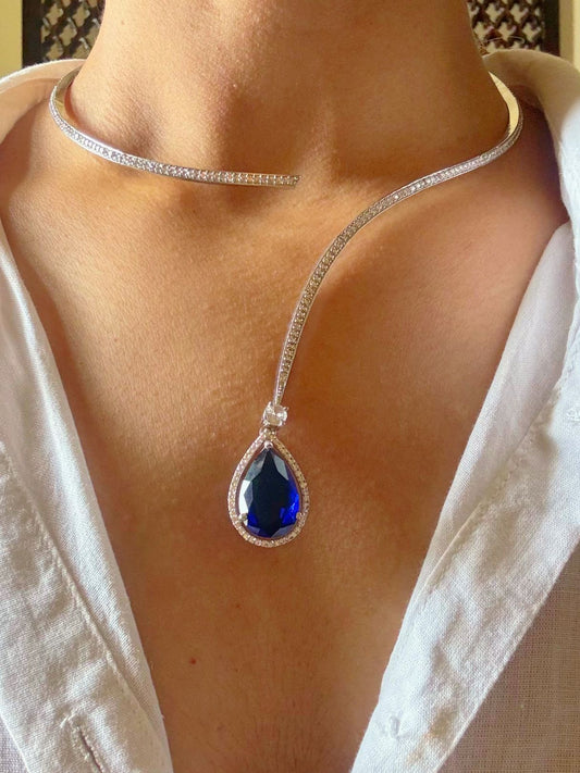 Buy Hasli Set With Sapphire Blue Drop in AD online in India. Shop from an exclusive range of zircon jewellery, Indian wedding jewelry, gold plated earrings, rhodium plated jewellery, AD earrings, AD necklace sets for weddings and festive occasions in blue stone. -front