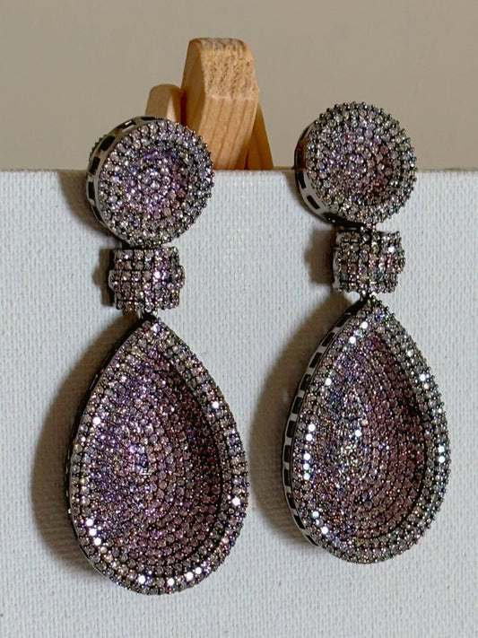 Shop women's Long Nano Setting AD Earrings In Pink online in India. Shop from an exclusive range of zircon jewellery, bridal wedding jewelry, silver plated earrings, rhodium plated jewellery, AD earrings, AD earrings sets for office parties, cocktail dresses and sangeet night. -front