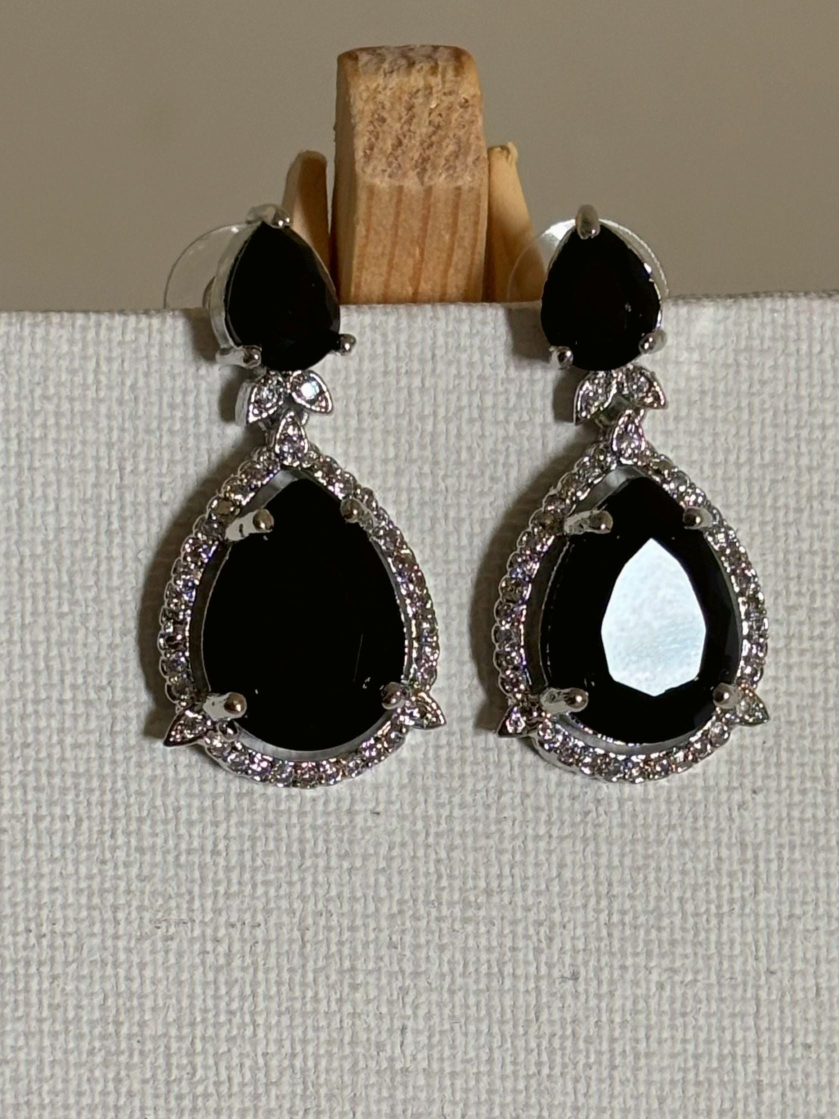 Shop Celebrity Look Double Drop Black Stone AD Earrings online. Shop from an exclusive range of zircon earrings, bridal AD jewelry, silver plated earrings, rhodium plated jewellery, AD earrings, AD necklace sets for coats, gowns and lehengas.  -Upper 