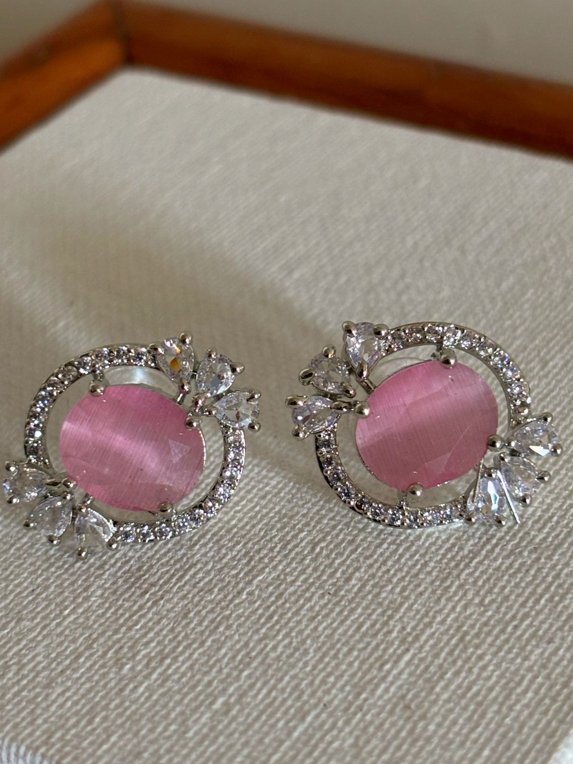 Shop Celebrity Studs In AD & Pink stone online. Shop from an exclusive range of zircon earrings, bridal AD jewelry, silver plated earrings, rhodium plated jewellery, AD earrings, AD necklace sets for weddings, engagements and parties.  -front