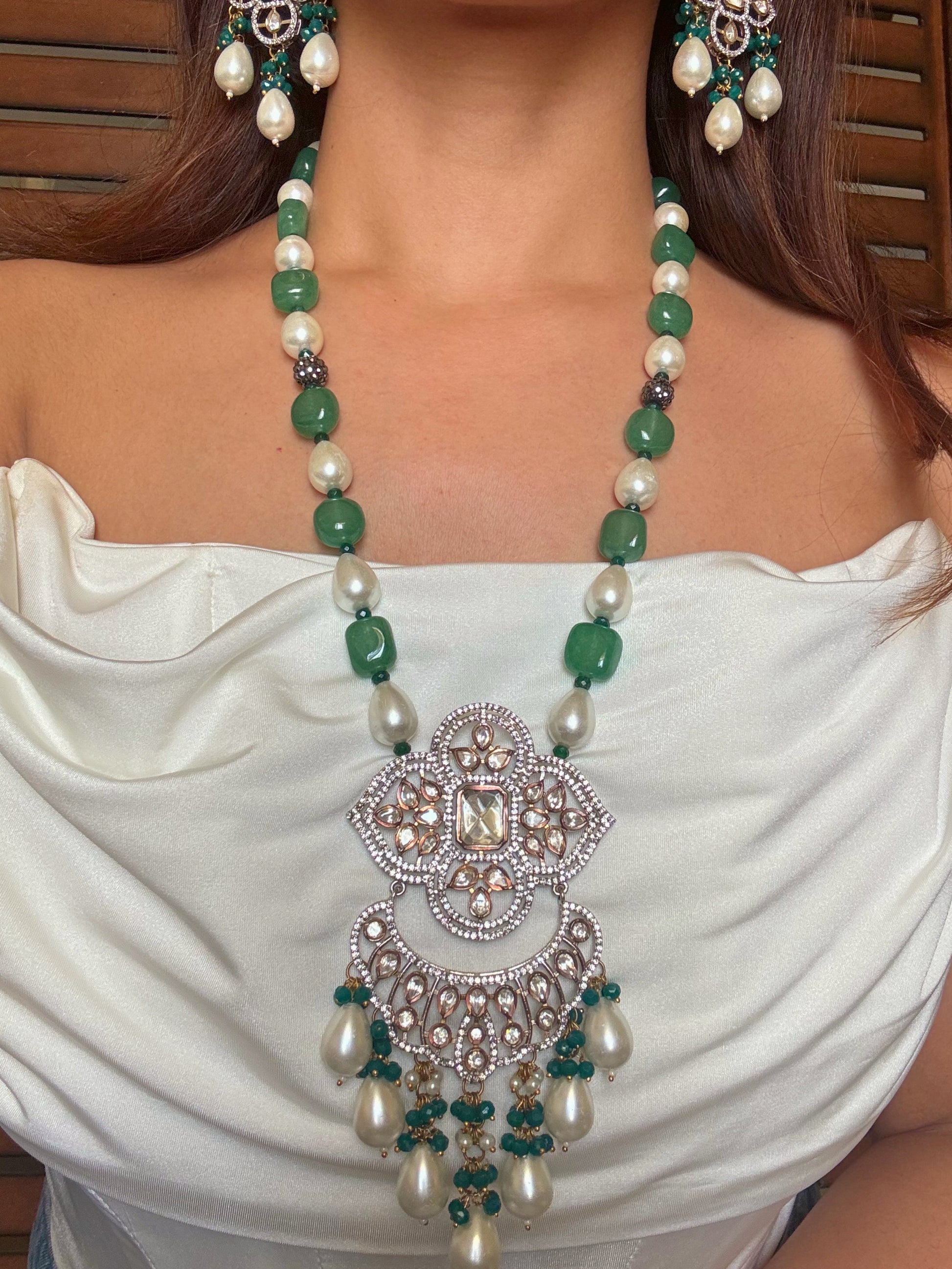 Shop pearl and emerald long kundan necklace set online in India. Shop from an exclusive range of CZ jewellery, gold plated, silver plated jewellery, gold polish earrings. -full view