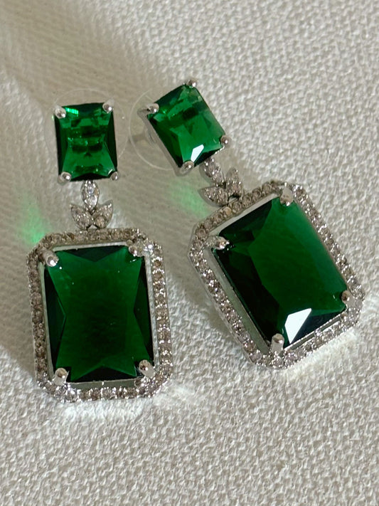 Shop women's luxury white doublet stone AD earrings online in India. Shop from an exclusive range of zircon jewellery, Indian wedding jewelry, AD earrings with saree, rhodium plated jewellery, AD necklace sets for weddings and engagement. AD jewellery in green stone. -Front