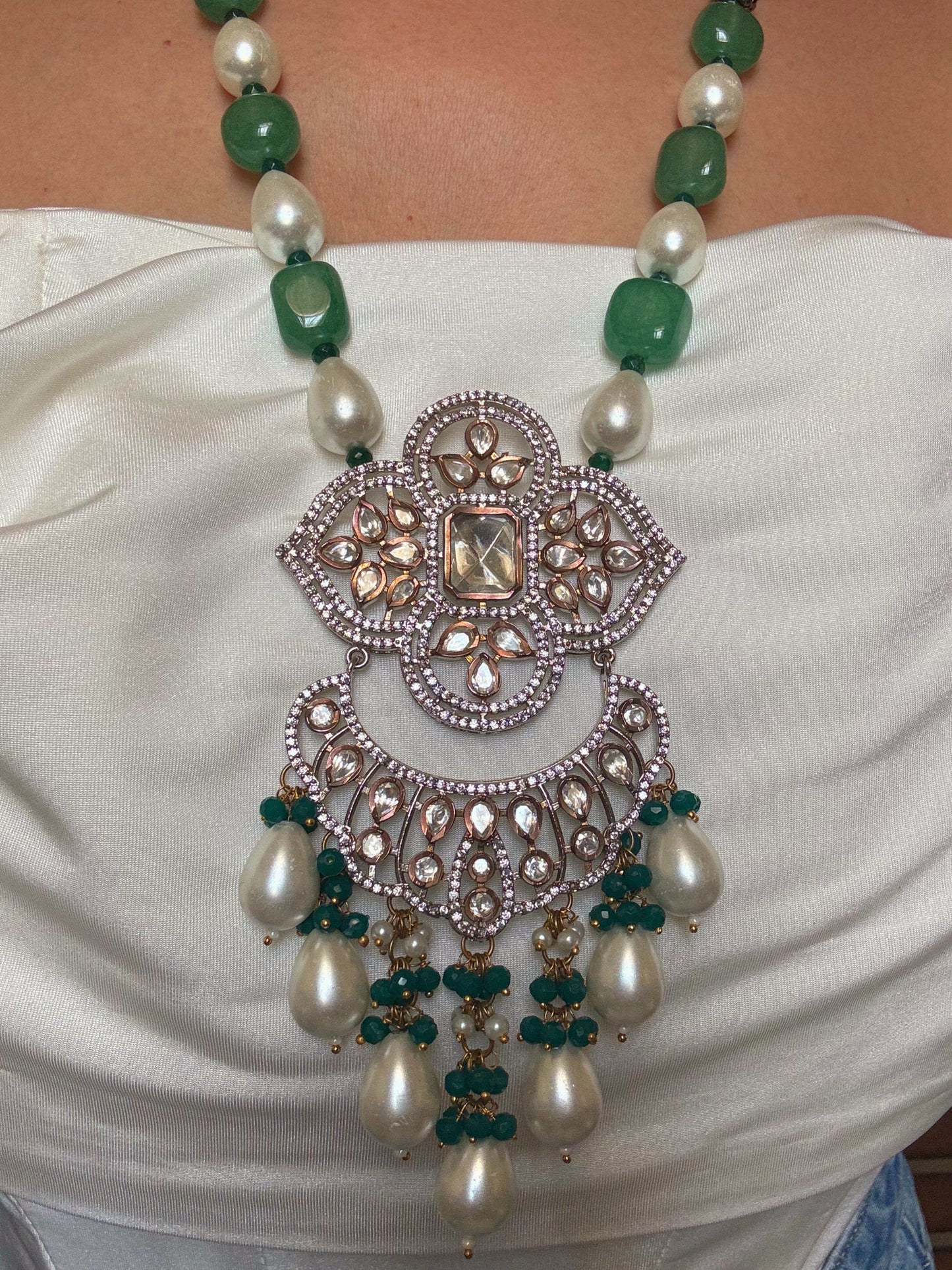Shop pearl and emerald long kundan necklace set online in India. Shop from an exclusive range of CZ jewellery, gold plated, silver plated jewellery, gold polish earrings. -pendant