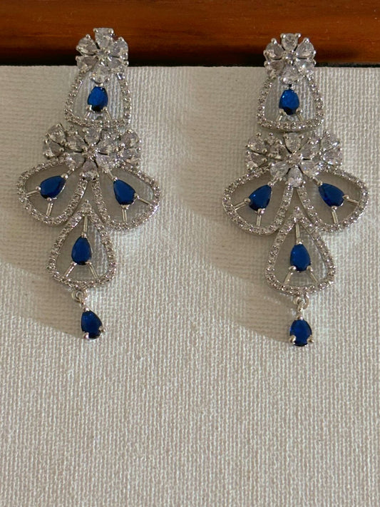 Shop women's luxury blue stone AD earrings online in India. Shop from an exclusive range of zircon jewellery, Indian wedding jewelry, gold plated earrings, rhodium plated jewellery, AD earrings, AD necklace sets for weddings, engagements and parties.  -front