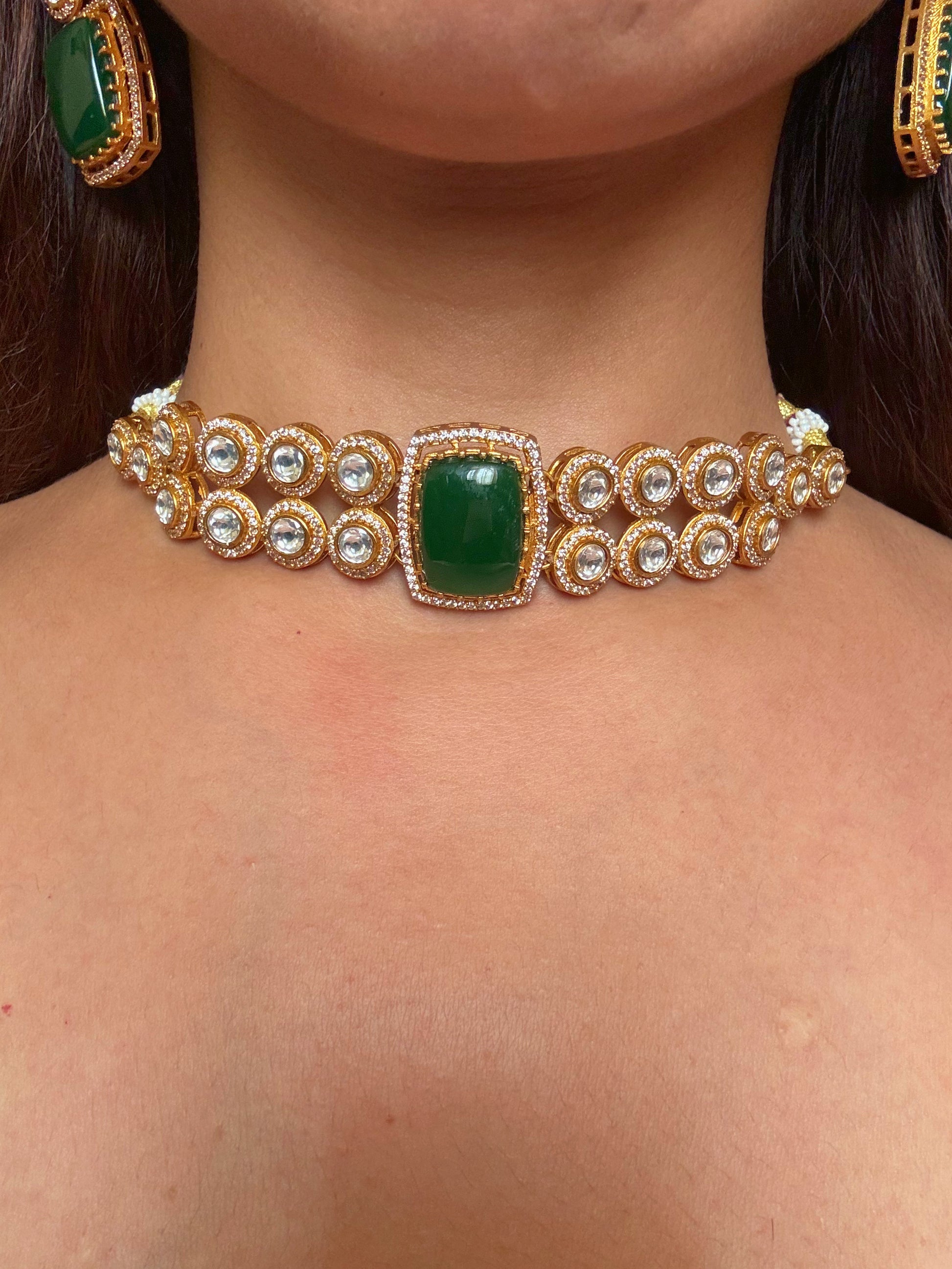 Shop mankiya green stone kundan choker set online in India. Shop from an exclusive range of CZ jewellery, gold plated, silver plated jewellery, gold polish earrings. -front