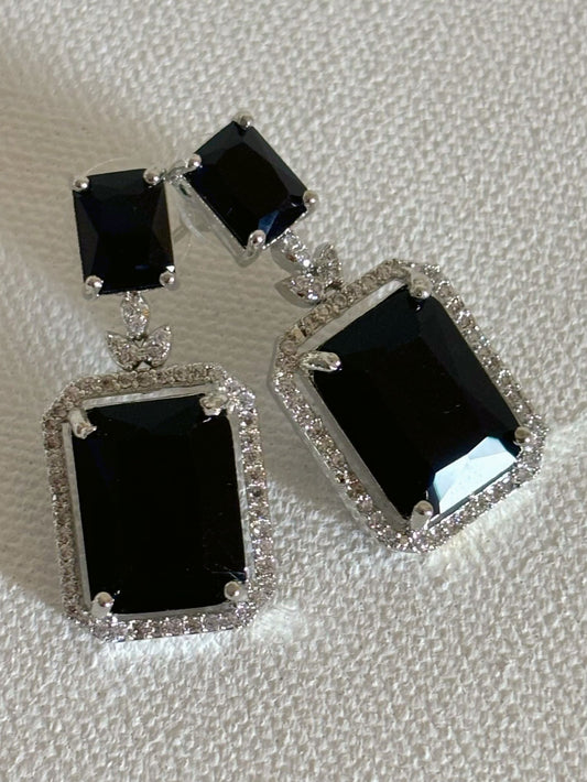 Shop women's luxury white doublet stone AD earrings online in India. Shop from an exclusive range of zircon jewellery, Indian wedding jewelry, AD earrings with saree, rhodium plated jewellery, AD necklace sets for weddings and engagement. AD jewellery in black stone. -front