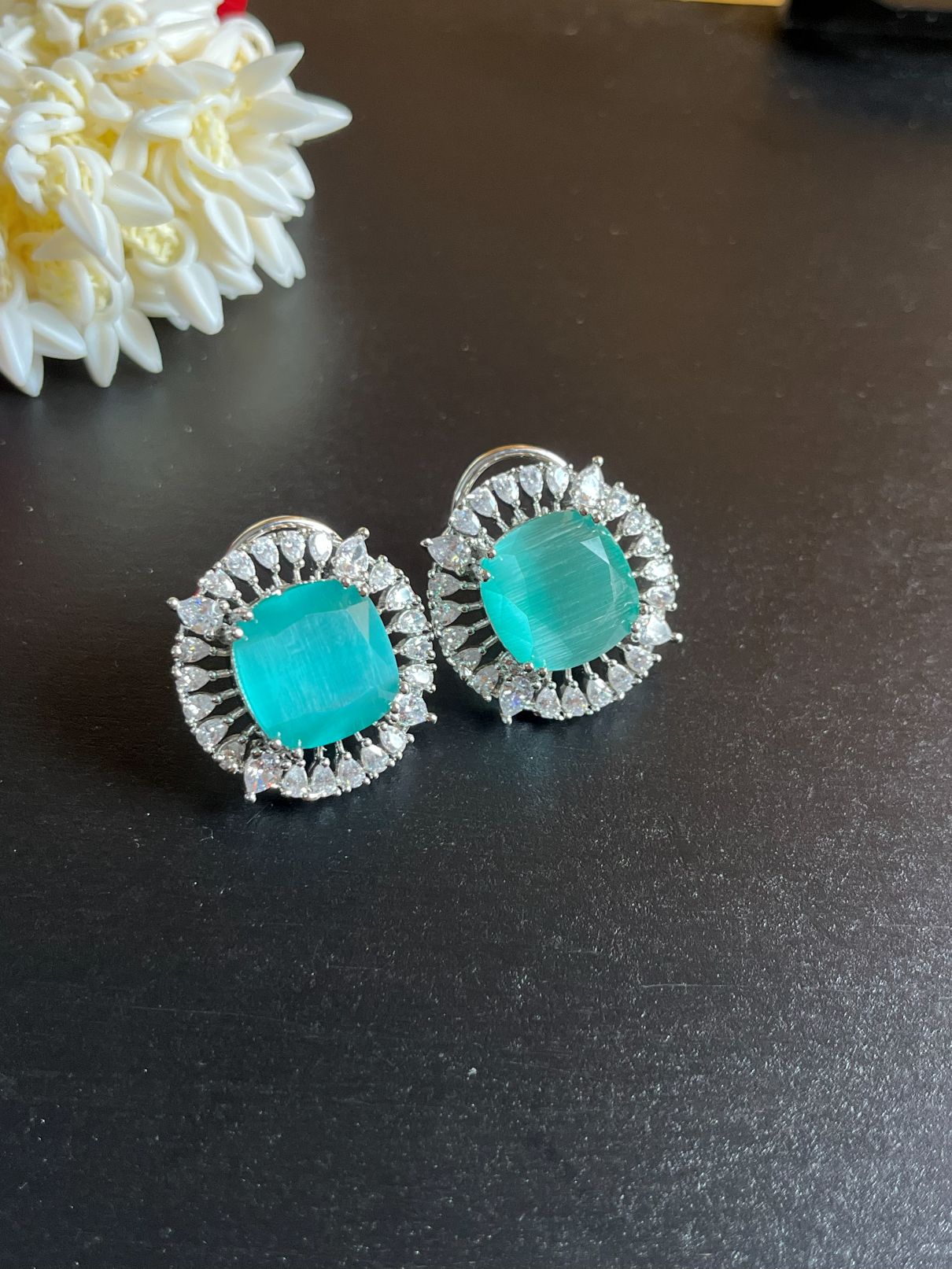 Shop Big Studs In AD & Mint Green Doublet Stone online. Shop from an exclusive range of zircon earrings, bridal AD jewelry, AD earrings, AD necklace sets.