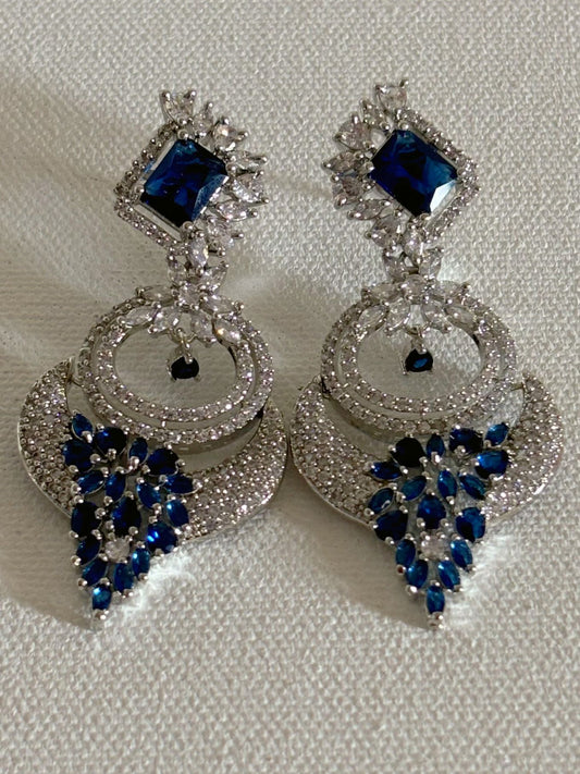 Shop women's Designer AD Earrings With Blue Stone  online in India. Shop from an exclusive range of zircon jewellery, bridal wedding jewelry, silver plated earrings, rhodium plated jewellery, AD earrings, AD necklace sets for Lehengas, suits, sarees and gowns. -front