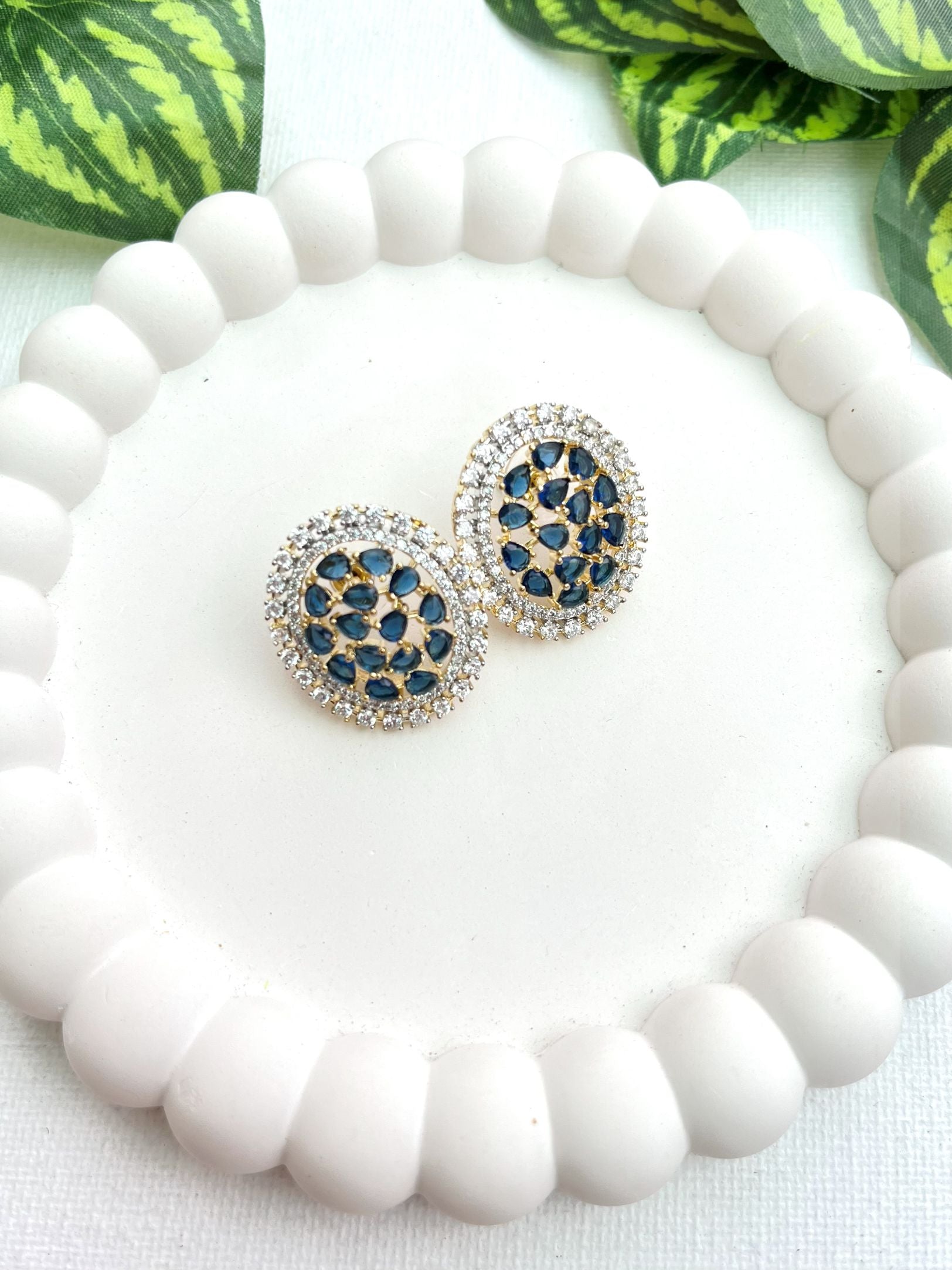 Shop Oval Studs In Blue & AD Stones online in India. Shop from an exclusive range of zircon jewellery, bridal wedding jewelry, silver plated earrings, rhodium plated jewellery, AD earrings, AD earrings sets for office parties, party wear and weddings. -front