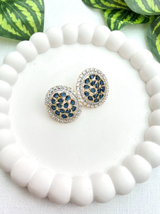 Shop Oval Studs In Blue & AD Stones online in India. Shop from an exclusive range of zircon jewellery, bridal wedding jewelry, silver plated earrings, rhodium plated jewellery, AD earrings, AD earrings sets for office parties, party wear and weddings. -front