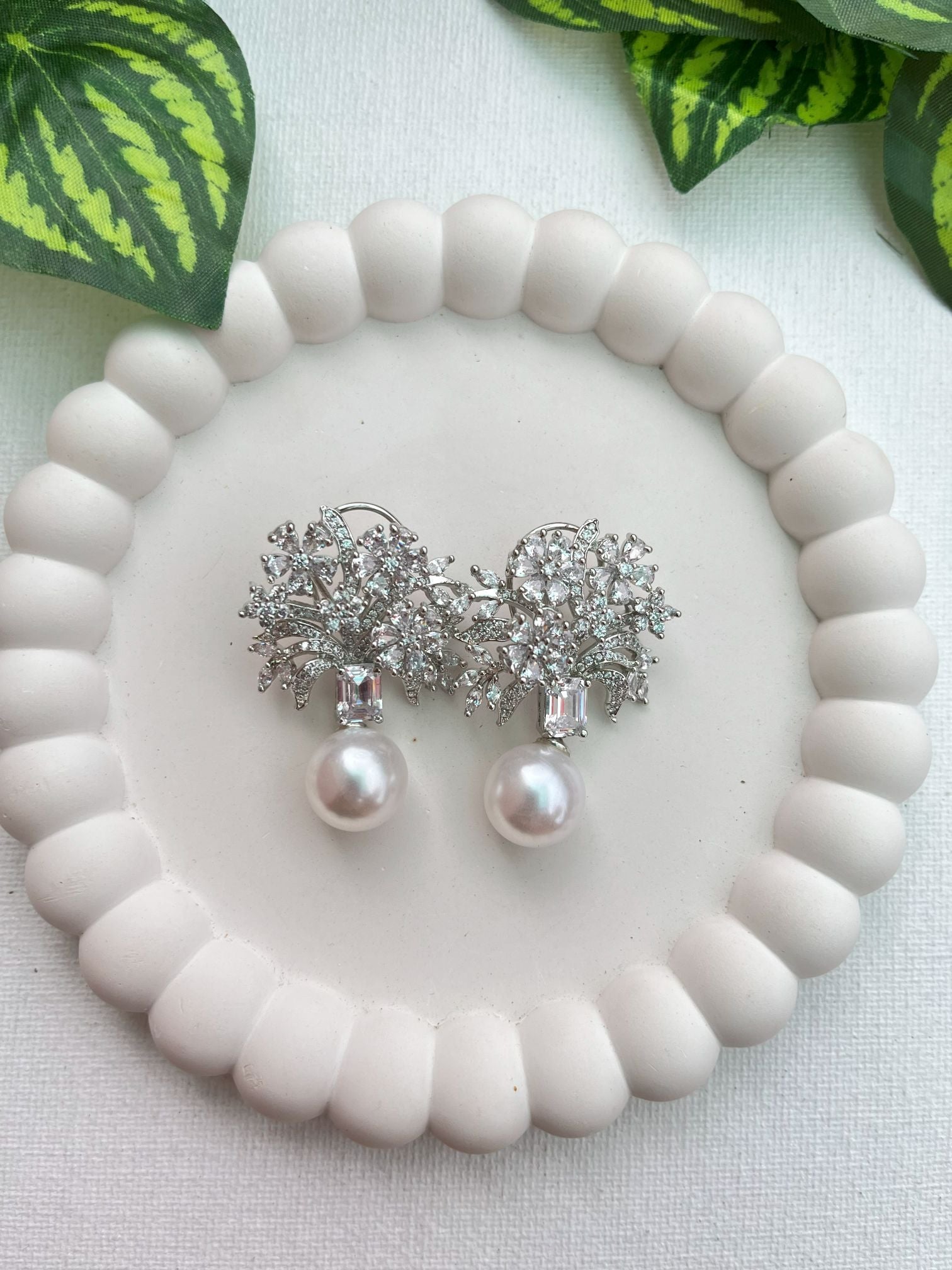 Shop Etasha CZ Floral Earrings With Big Pearl Drop online in India. Shop AD earrings, bridal AD jewelry, AD necklace sets for weddings, engagements and parties.  