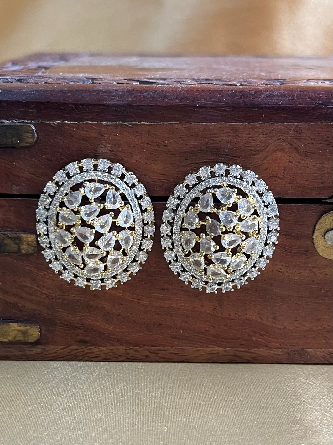 Shop Pamila Oval Studs In AD & White Stones online in India. Shop AD earrings, bridal AD jewelry, AD necklace sets for weddings, engagements and parties.  