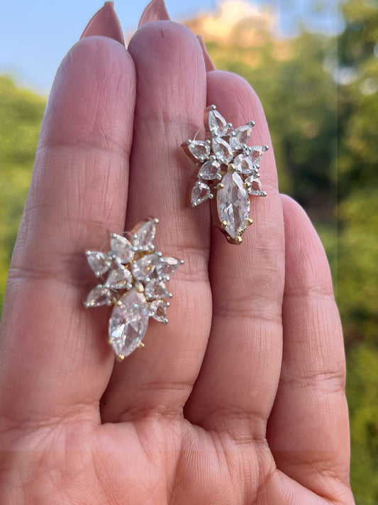 Shop Floral Studs Earrings In CZ Stones Gold Polish online in India. Shop from an exclusive range of zircon jewellery, Indian wedding jewelry, gold plated earrings, rhodium plated jewellery, AD earrings, AD necklace sets for weddings, engagements and parties. -front