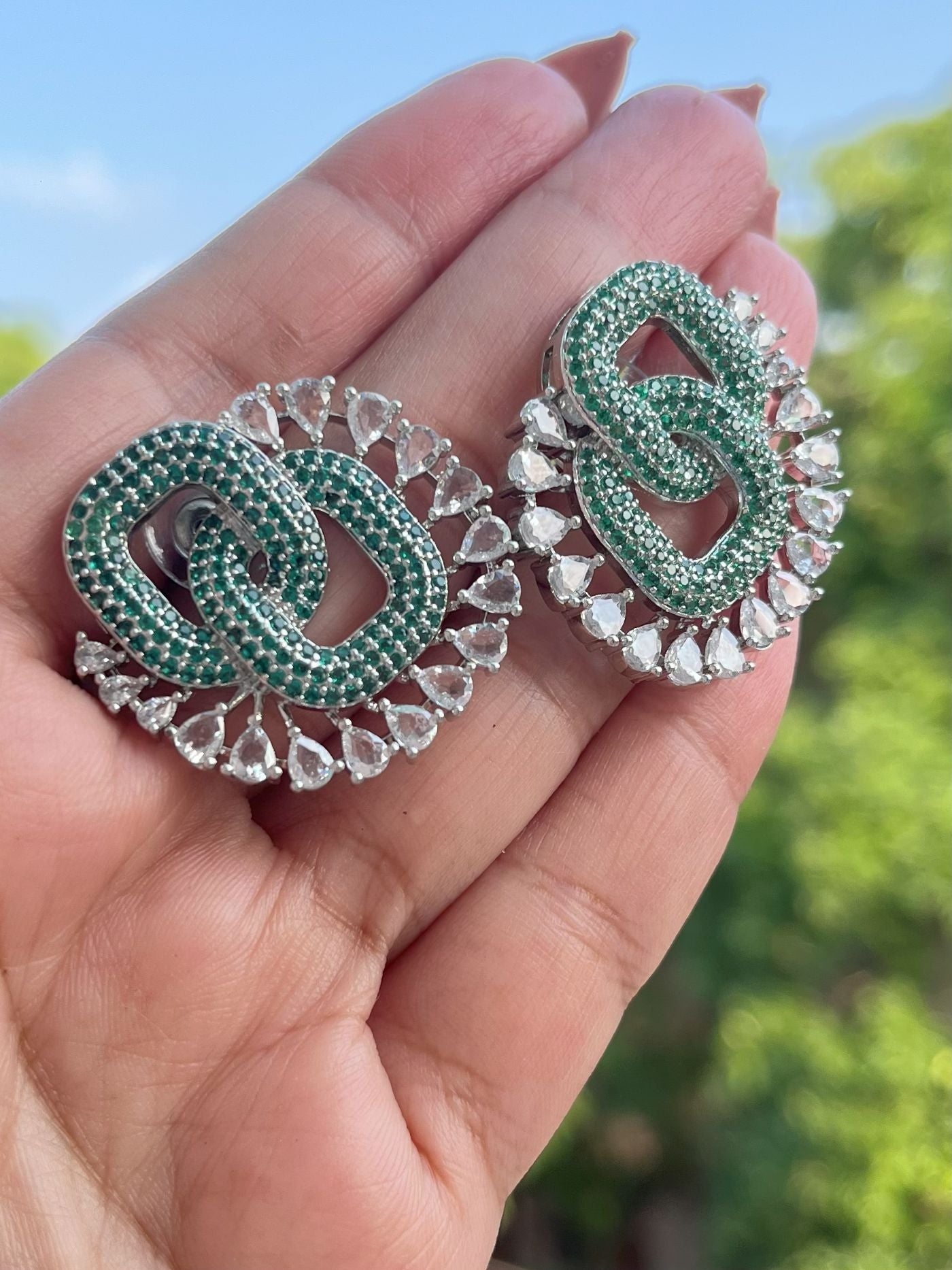 Shop Premium CZ Stones Stud Earrings In Green online in India. Shop AD earrings, bridal AD jewelry, AD necklace sets for weddings, engagements and parties.  