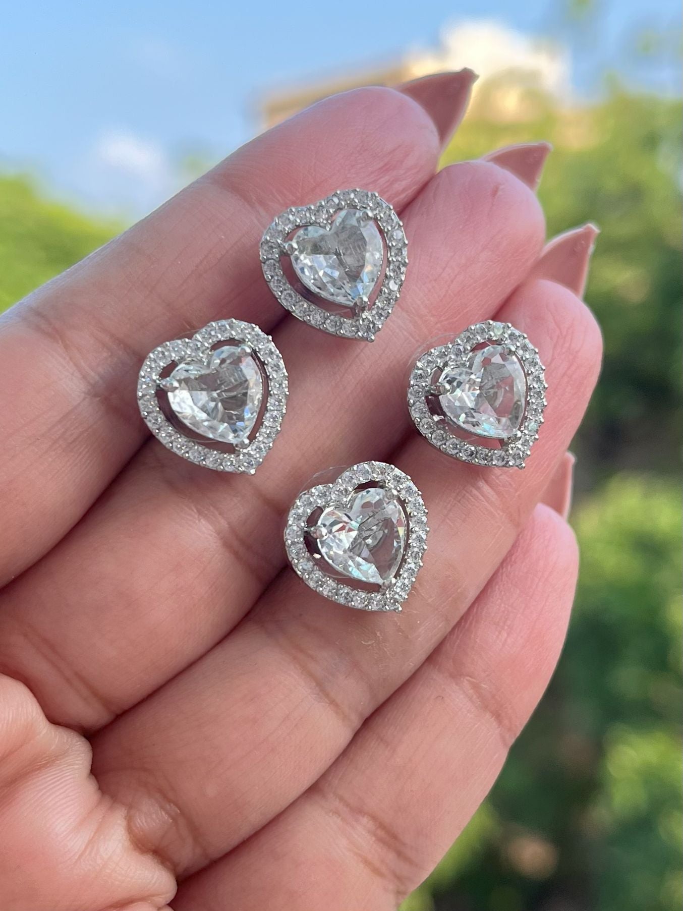 Shop Farida Heart Shaped Stud Earrings In AD online in India. Shop AD earrings, bridal AD jewelry, AD necklace sets for weddings, engagements and parties.  