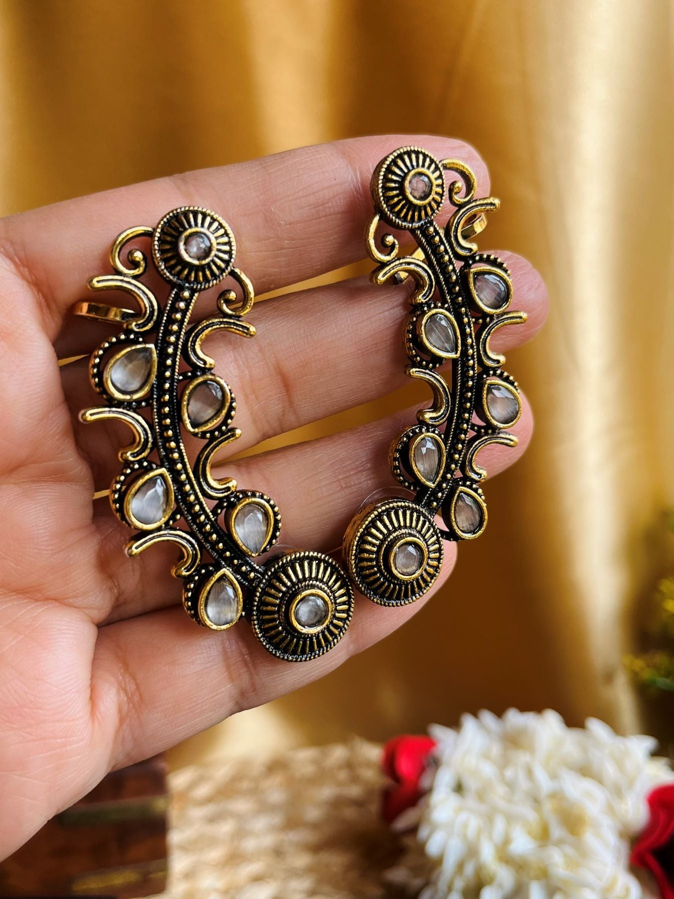 Buy Dull Golden White Stone Traditional Ear Cuffs online in India. Shop oxidized jewellery for festivals and office and daily wearing in affordable range.