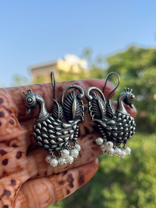 Buy Peacock Motive Antique Silver Oxidized Earrings online in India. Shop oxidized jewellery for festivals and office and daily wearing in affordable range.