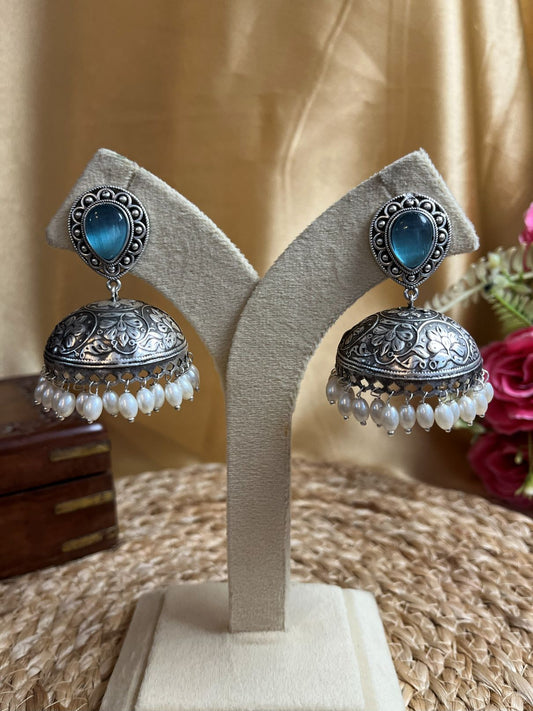 Shop Ayra Silver Plated Blue Stone Oversized Jhumka online in India. Shop oxidized jewellery for festivals and office and daily wearing in affordable range.