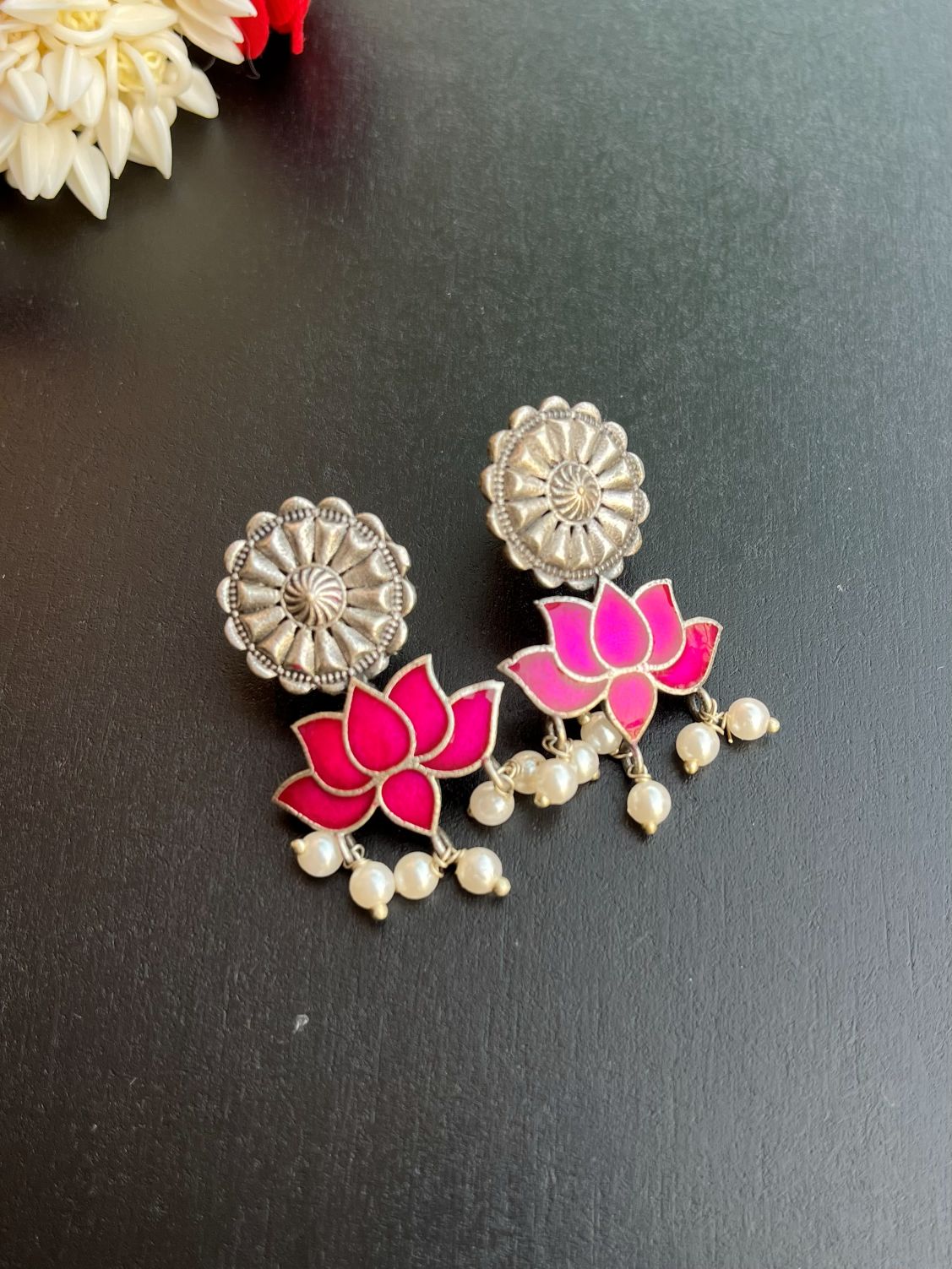 Buy Antique Polish Silver Lotus Meenakari Earrings In Rani online in India. Shop oxidized jewellery for festivals and office and daily wearing in affordable range.