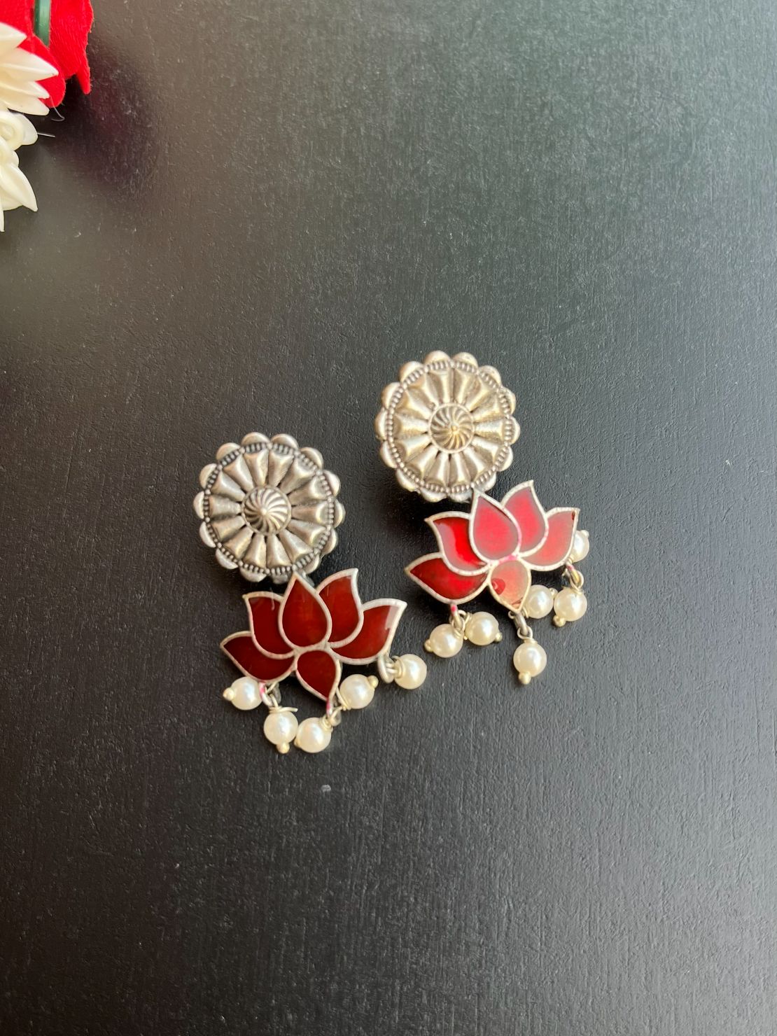 Buy Antique Polish Silver Lotus Meenakari Earrings In Red online in India. Shop oxidized jewellery for festivals and office and daily wearing in affordable range.