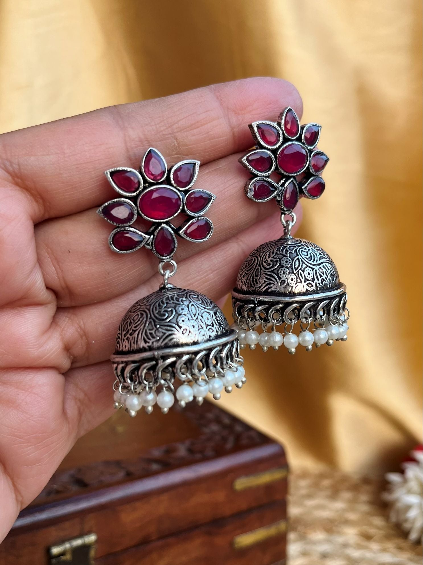 Buy Alizeh Oxidized Jhumka Earrings In Reddish Pink Stone online in India. Shop oxidized jewellery for festivals and office and daily wearing in affordable range.