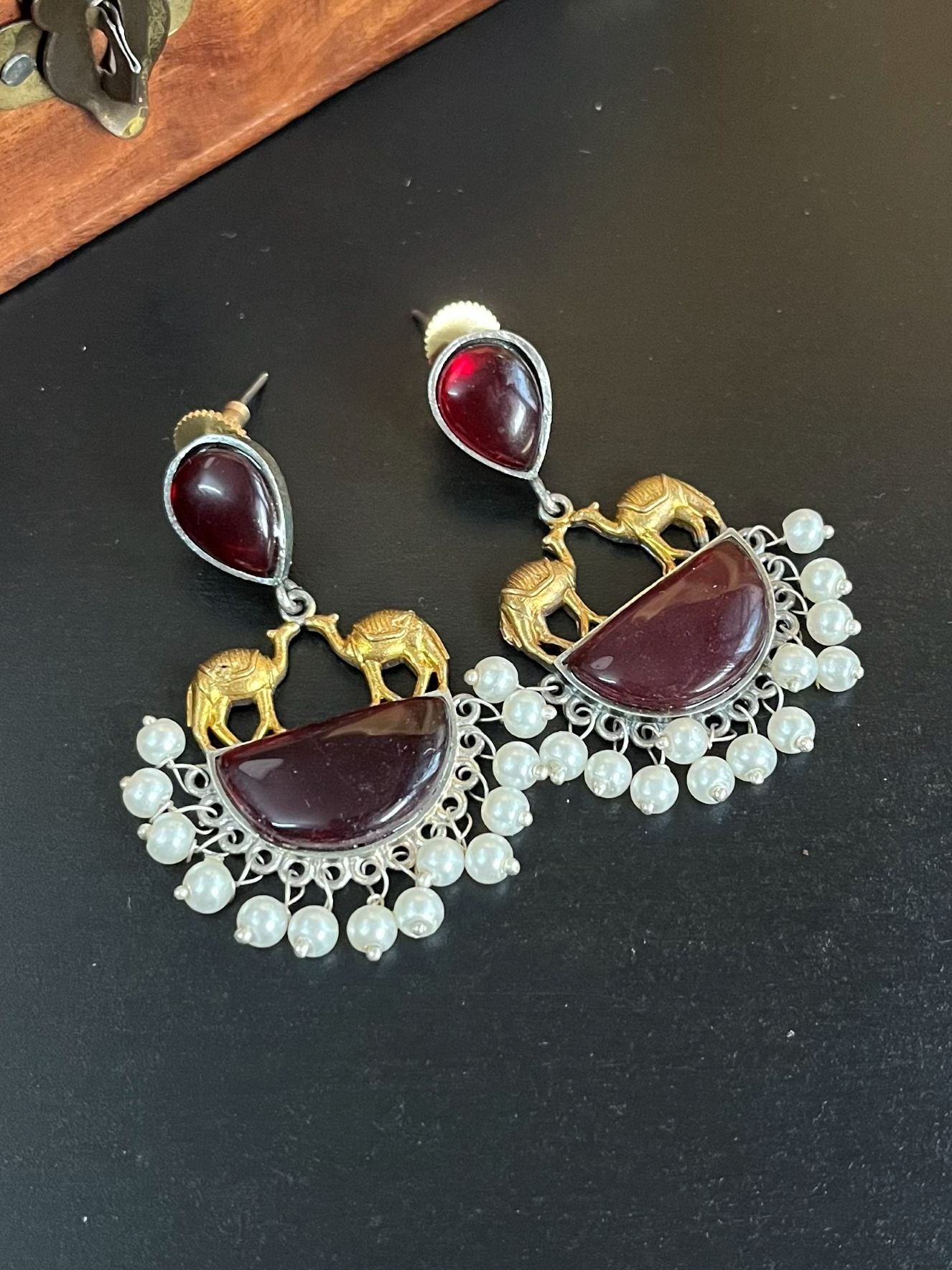 Buy Monalisa Red Stone Silver Lookalike Dual Tone Earrings online in India. Shop oxidized jewellery for festivals and office and daily wearing in affordable range.