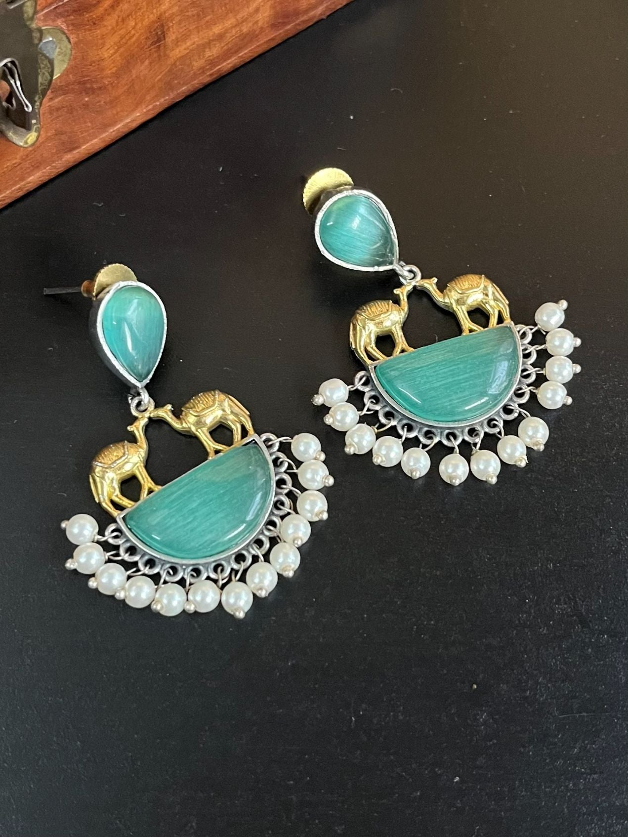 Buy Monalisa Mint Green Stone Silver Lookalike Dual Tone Earrings online in India. Shop oxidized jewellery for festivals and office and daily wearing in affordable range.