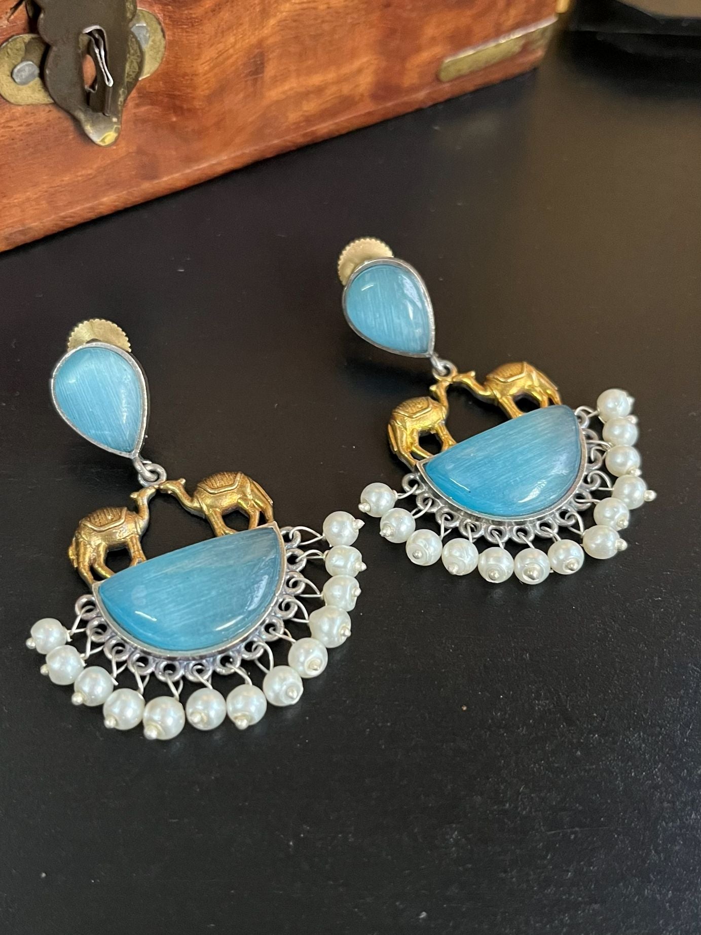 Buy Monalisa Aqua Blue Stone Silver Lookalike Dual Tone Earrings online in India. Shop oxidized jewellery for festivals and office and daily wearing in affordable range.