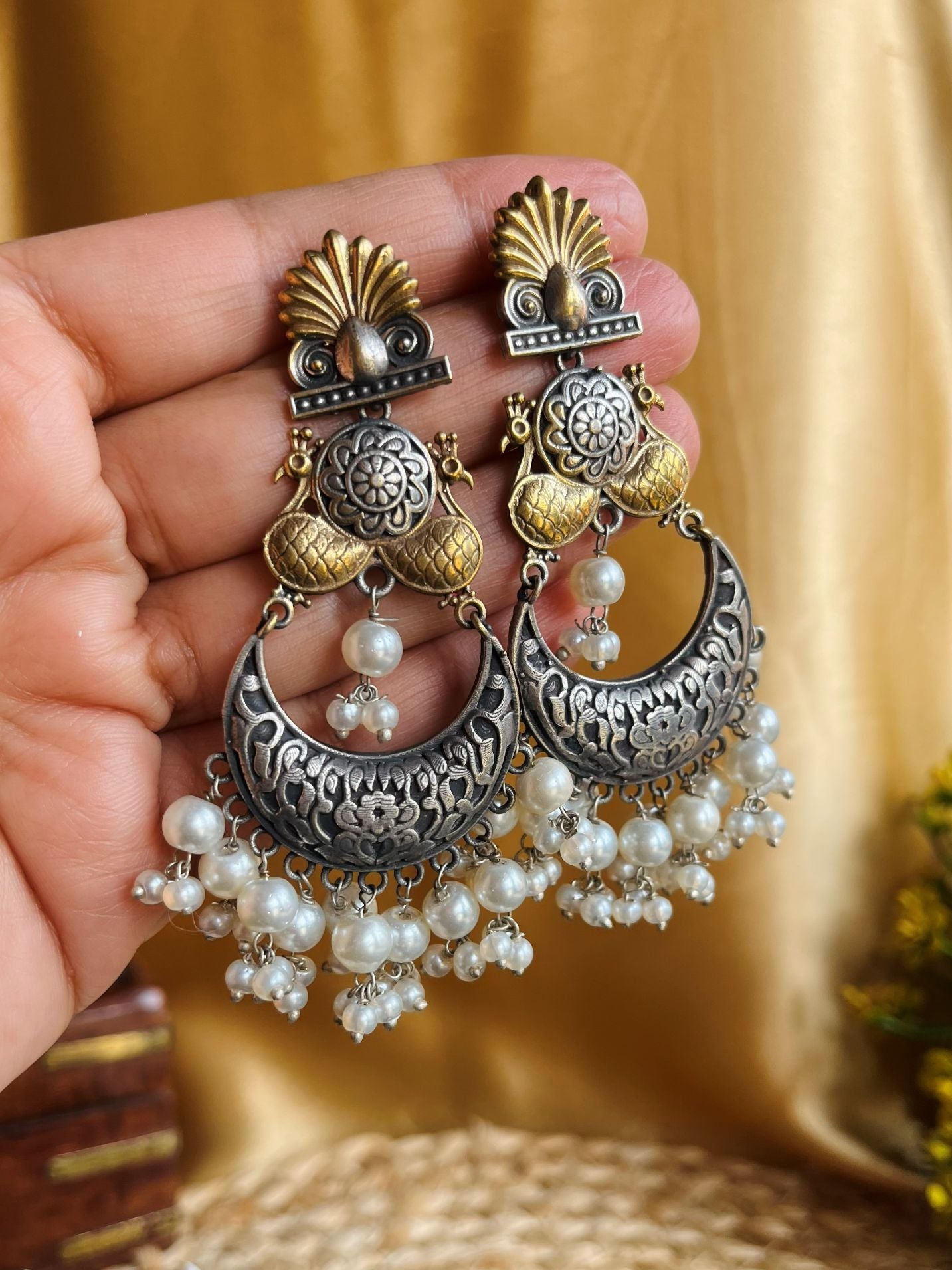 Buy Kavya Dual Tone Chandelier Pearl Drops Oxidised Earrings online in India. Shop oxidized jewellery for festivals and office and daily wearing in affordable range.-second